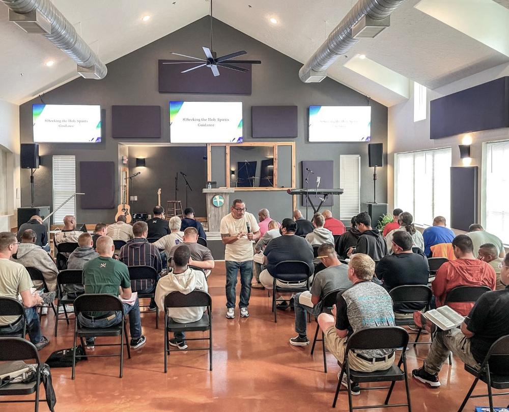 Residents seated in the chapel at the Men's Home during a service.