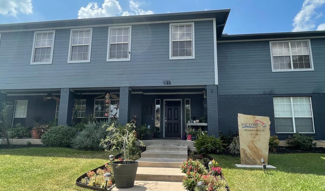 The Victory Women's Home, a blue two-story house in Fort Worth.